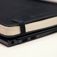 Check out how fat the Swift 7 makes a Moleskin notebook look, it’s crazy.